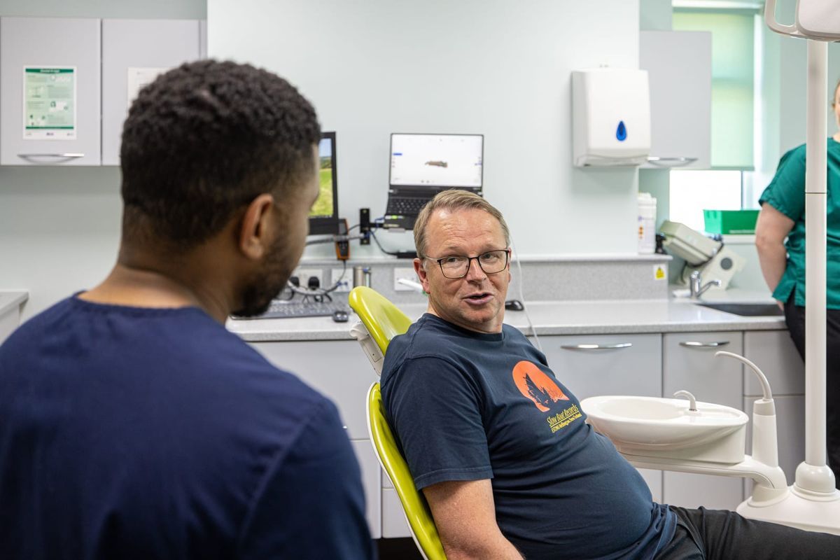 Patient talking with a dentist at Castle Park Dental Care in Cottingham
