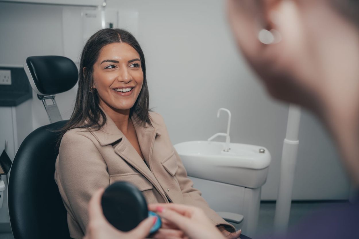 Invisalign aligner cases on a bathroom shelf